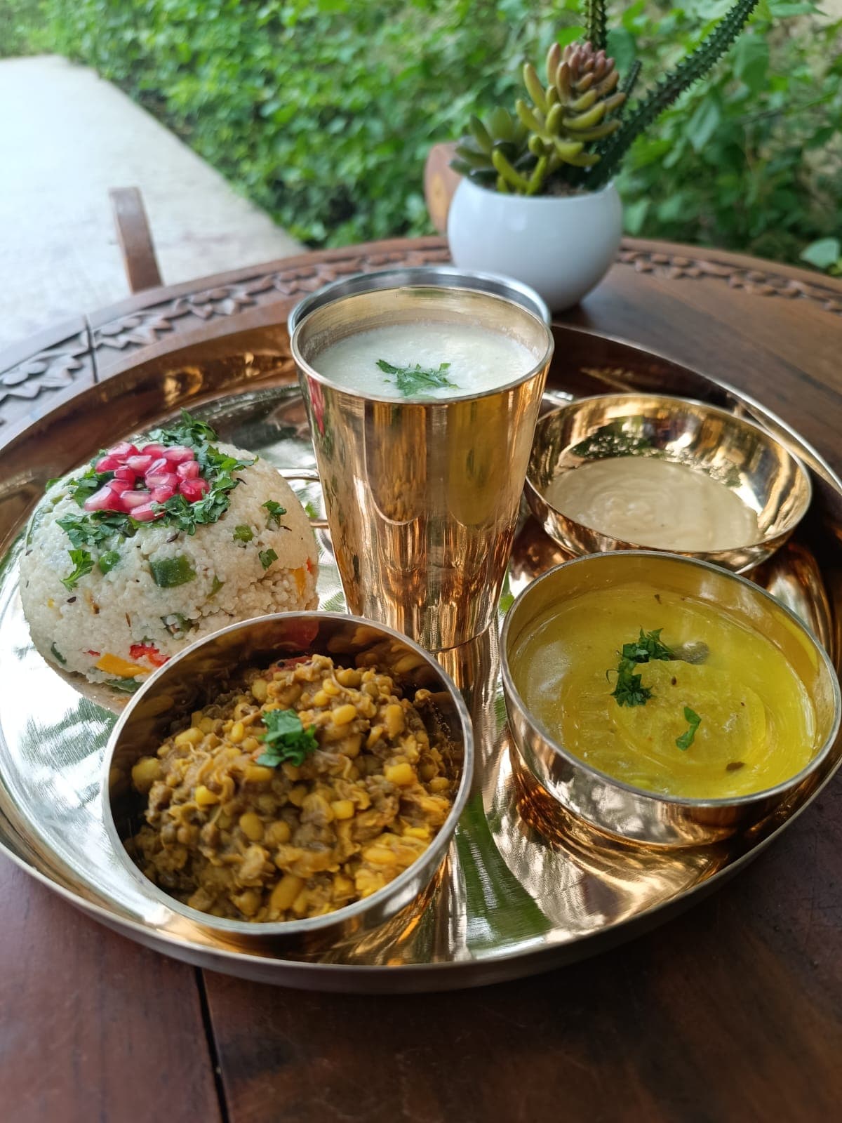 A wholesome meal served in a kansa thali
